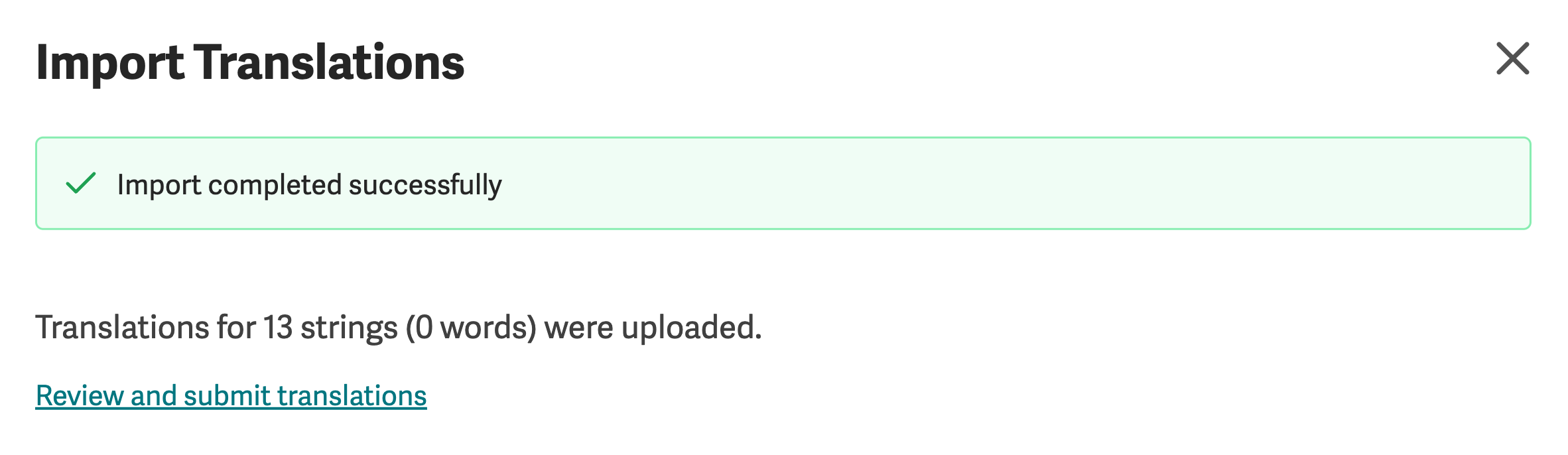 Import Translations dialog showing Import completed successfully and a Review and submit translations link